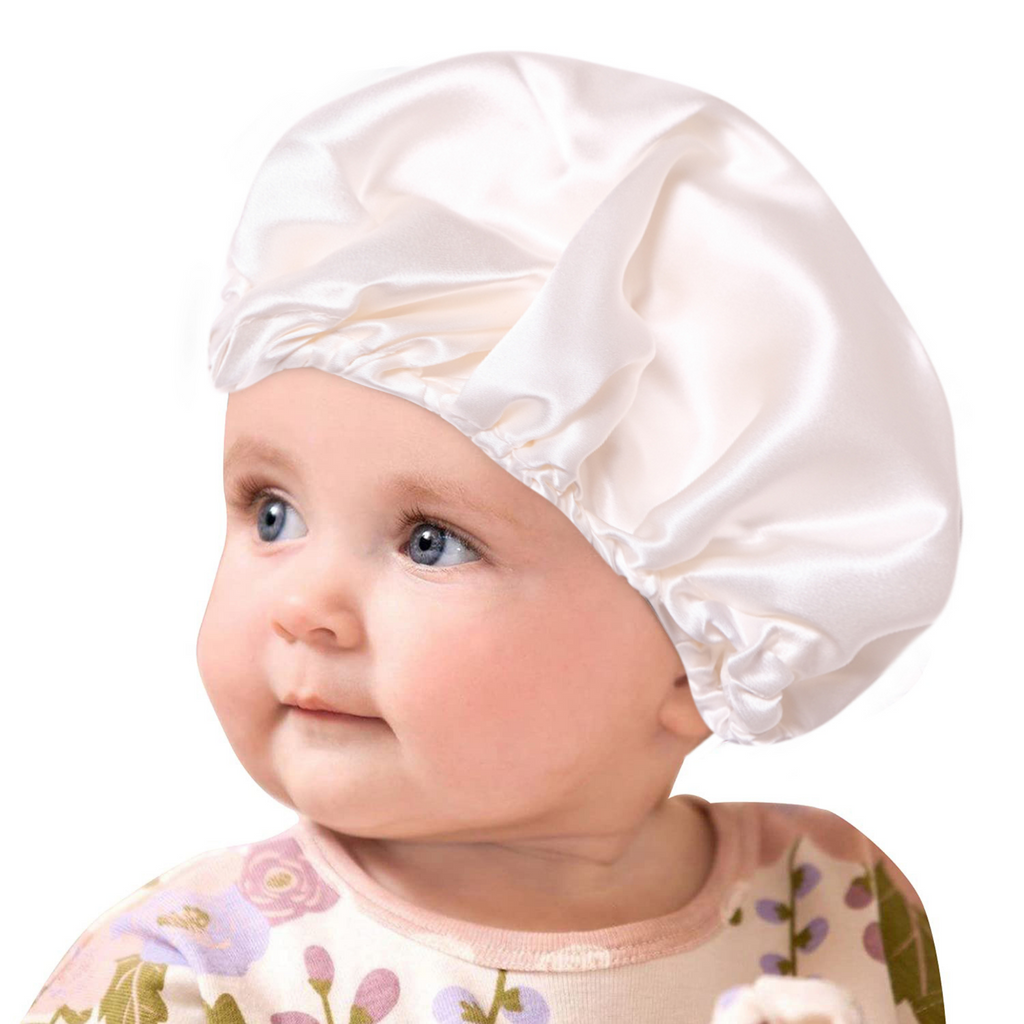 Baby wearing silk baby bonnet/cap
