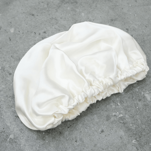 Silk hair Bonnet on a dark background used for hair protection